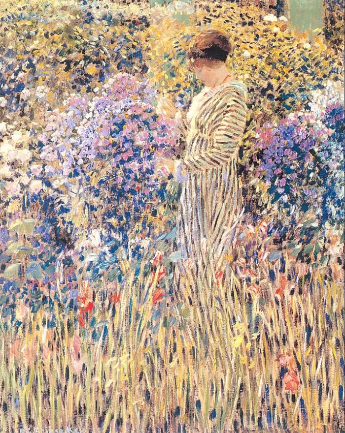 Lady In A Garden by Frederick Carl Frieseke