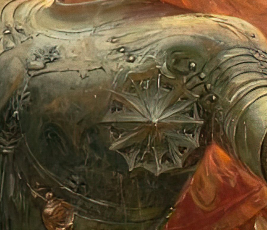 Close-up of the knight's breastplate, with a star-shaped decoration and polished steel