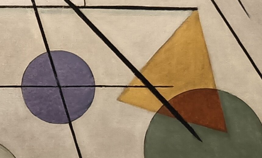 A purple circle and a yellow and brown triangle with a green circle in the lower right of the painting