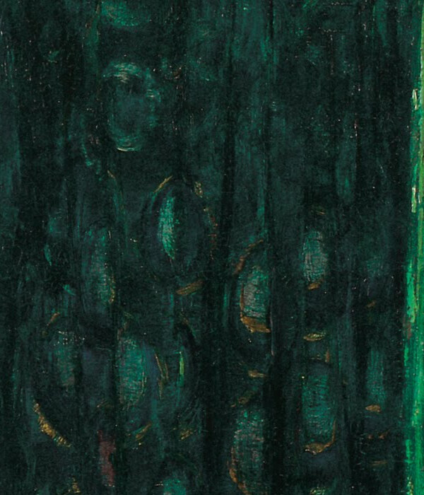 A dark green dress patterned with shapes like peacock feathers