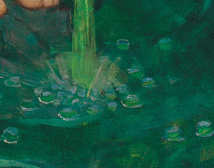 The green poison striking the water in a burst of bubbles