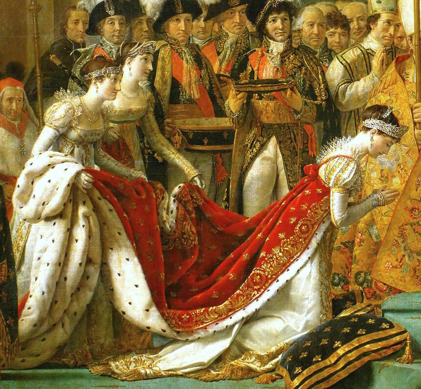 The Empress Josephine kneeling in a white satin gown and red velvet mantle, her hands joined