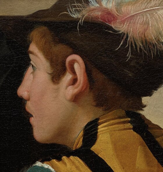 The young cheat's face turned toward his accomplice, eyes wide, mouth slightly open