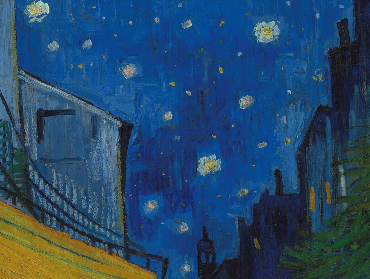 The deep blue sky over the street full of large white stars with soft halos
