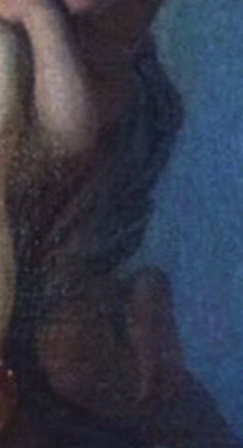 Dark drapery wrapped around the hips of the figure on the right