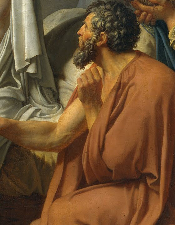 Crito seated beside the bed gripping Socrates' thigh and looking up into his face