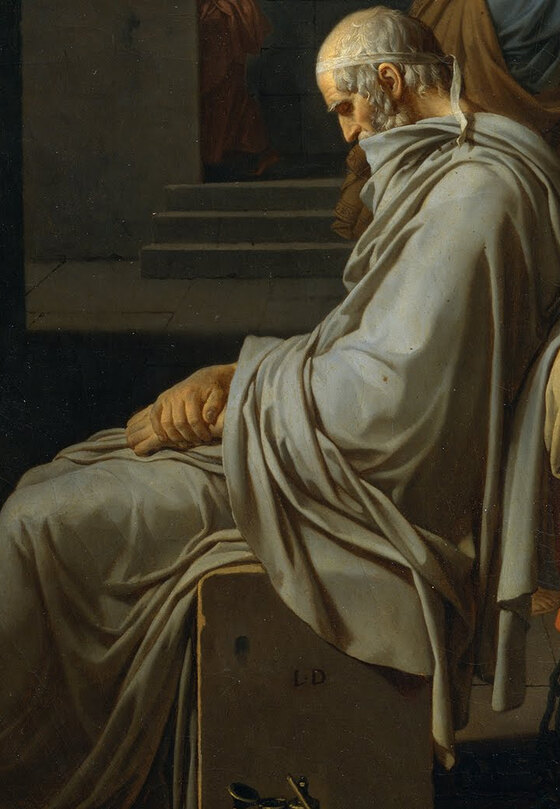 An old man in grey seated at the foot of the bed with his back to the scene, a scroll and pen beside him