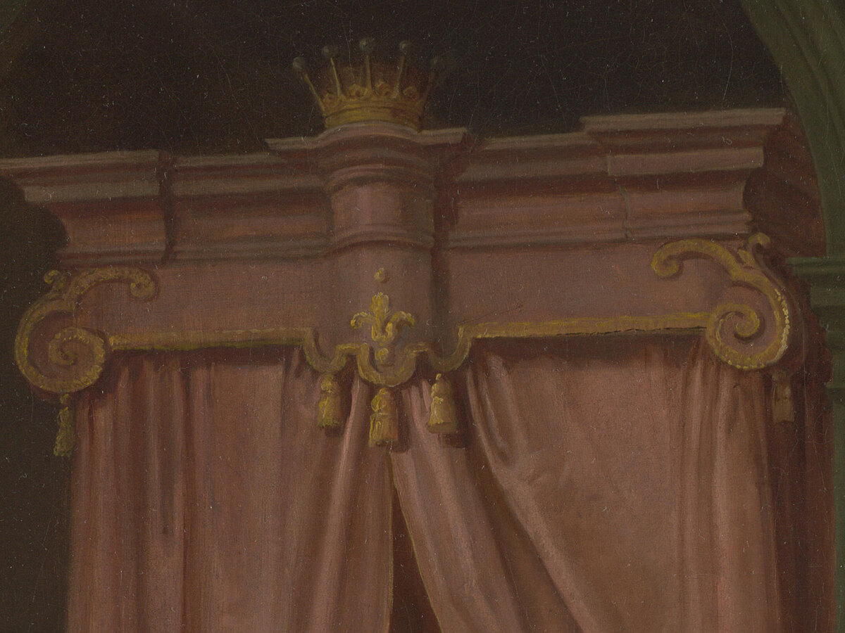 A pink canopied bed with a gilt coronet on the top of the canopy