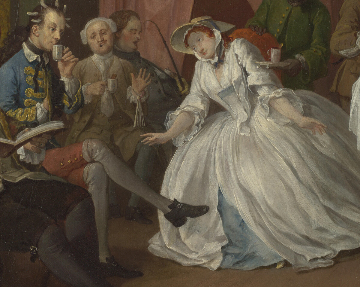 A lady in a white dress swooning with pleasure at the music, her hands spread, a fan on her lap; a man in curl papers and other guests behind
