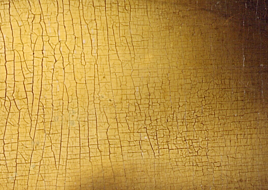 The Mona Lisa's forehead in close-up showing the fine network of cracks in the paint