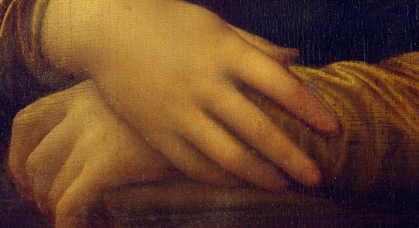 The Mona Lisa's folded hands resting on the arm of her chair
