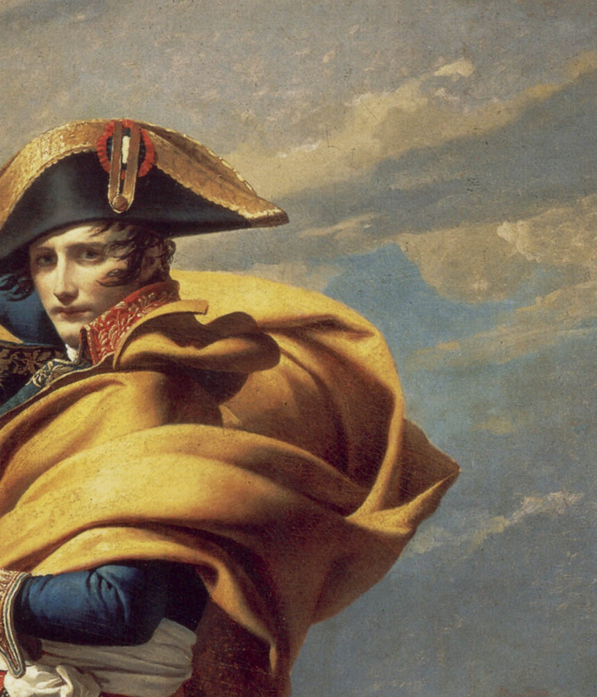 The orange-yellow cloak billowing up and back from Napoleon's shoulders
