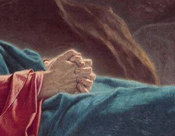 Christ's hands folded together on his chest as he sleeps