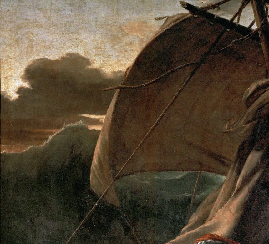 A large wave rising on the left behind the raft's sail