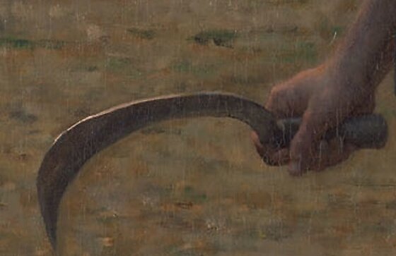 The girl's hand holding a sickle at her side