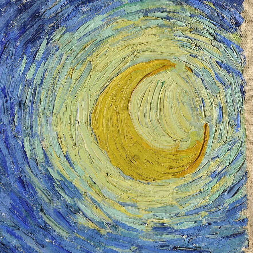 The crescent moon inside a bright yellow halo in the top right corner