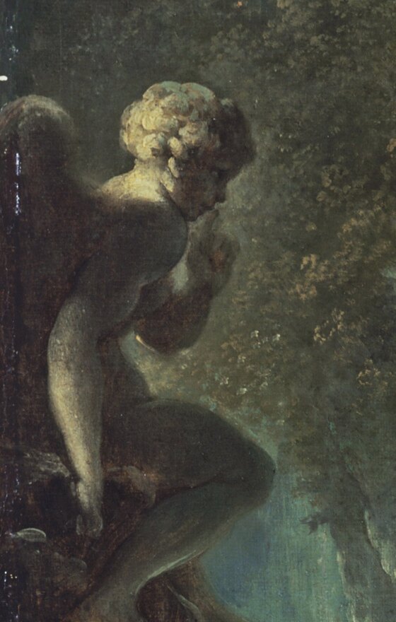 A stone statue of Cupid on a pedestal holding a finger to his lips