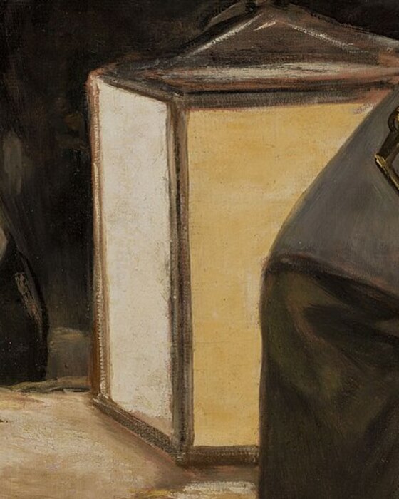 The square lantern on the ground between the soldiers and the prisoners, the only light in the painting