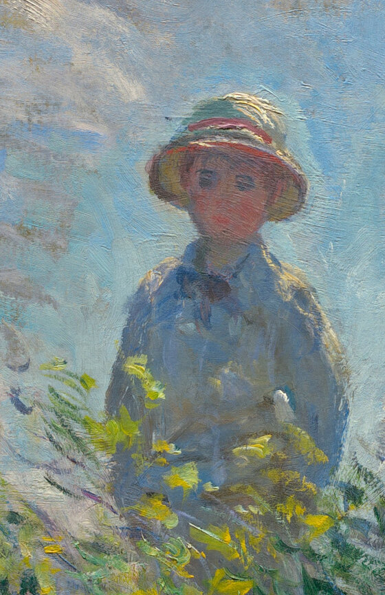 The Monets' son Jean standing in the tall grass behind his mother, in a straw hat