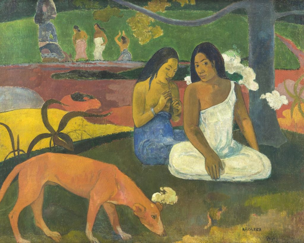 Arearea by Paul Gauguin, two Tahitian women sitting under a tree on red and yellow ground, with a red dog in the foreground and figures dancing before an idol behind