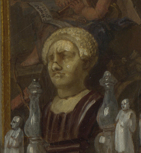 A battered antique bust among small white china figures on the mantelpiece