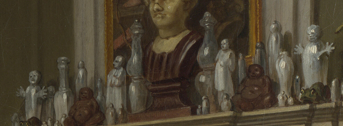 A row of small china figures and vases crowding a mantelpiece