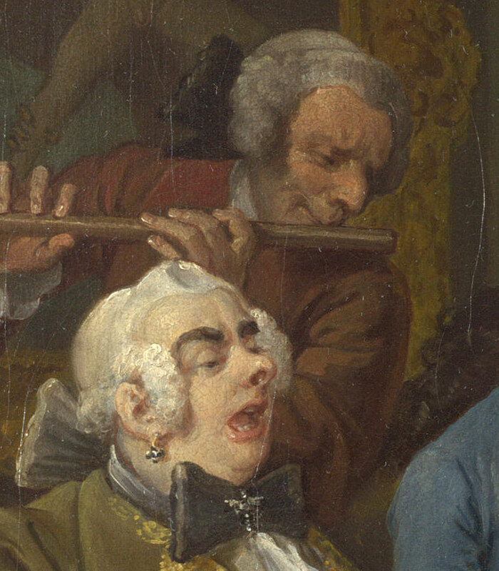 An opera singer singing with his head back and a flute player behind him