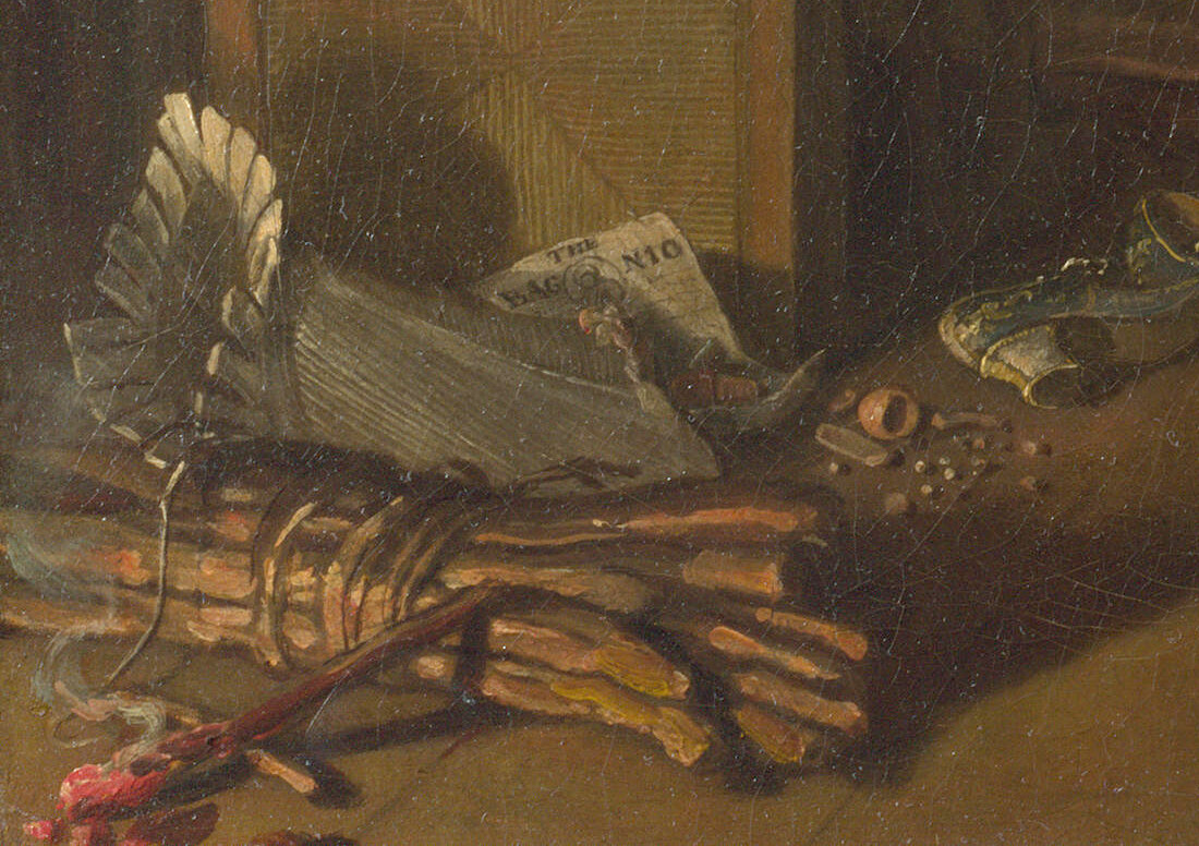 A corset lace lying across a bundle of firewood that has begun to smoulder