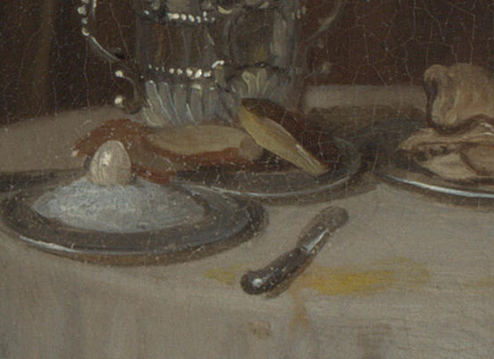 A single boiled egg on a plate of rice on the table