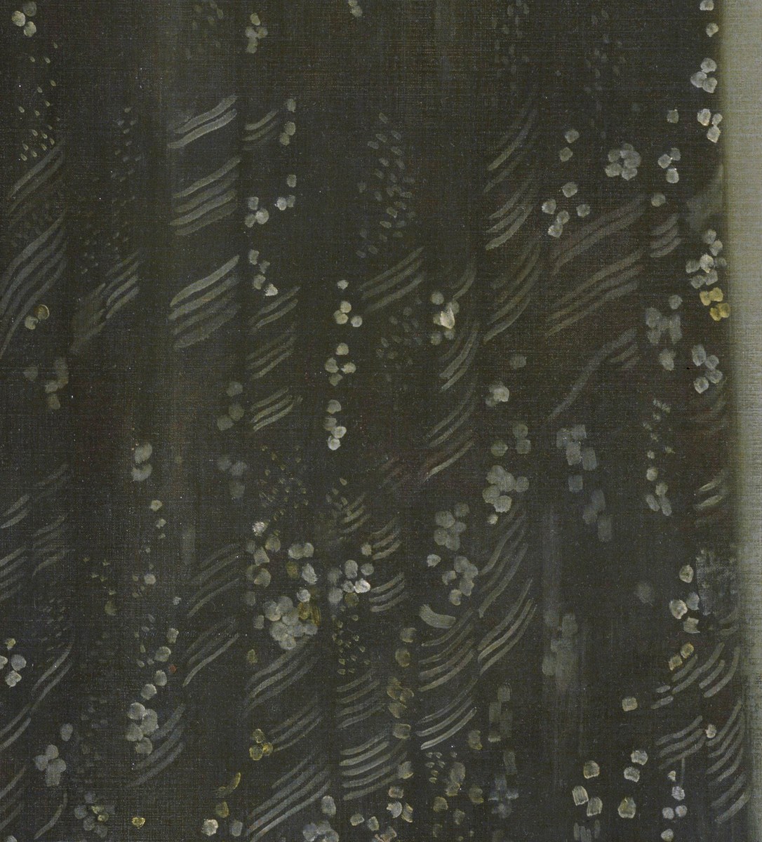 The dark curtain on the left, patterned with small pale flowers and diagonal stripes