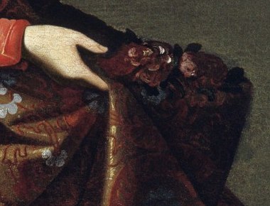 Saint Casilda's hand lifting a fold of her brocade skirt filled with red roses