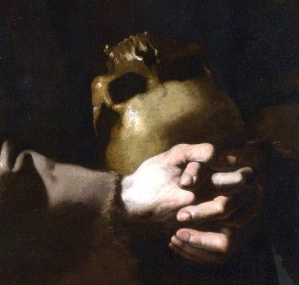 Saint Francis's clasped hands holding a human skull against his chest
