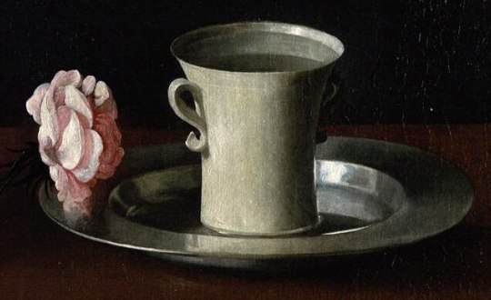 A pink rose lying on a pewter plate beside a pale two-handled cup of water