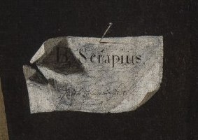 A small folded paper pinned to the dark background with the words B. Serapius